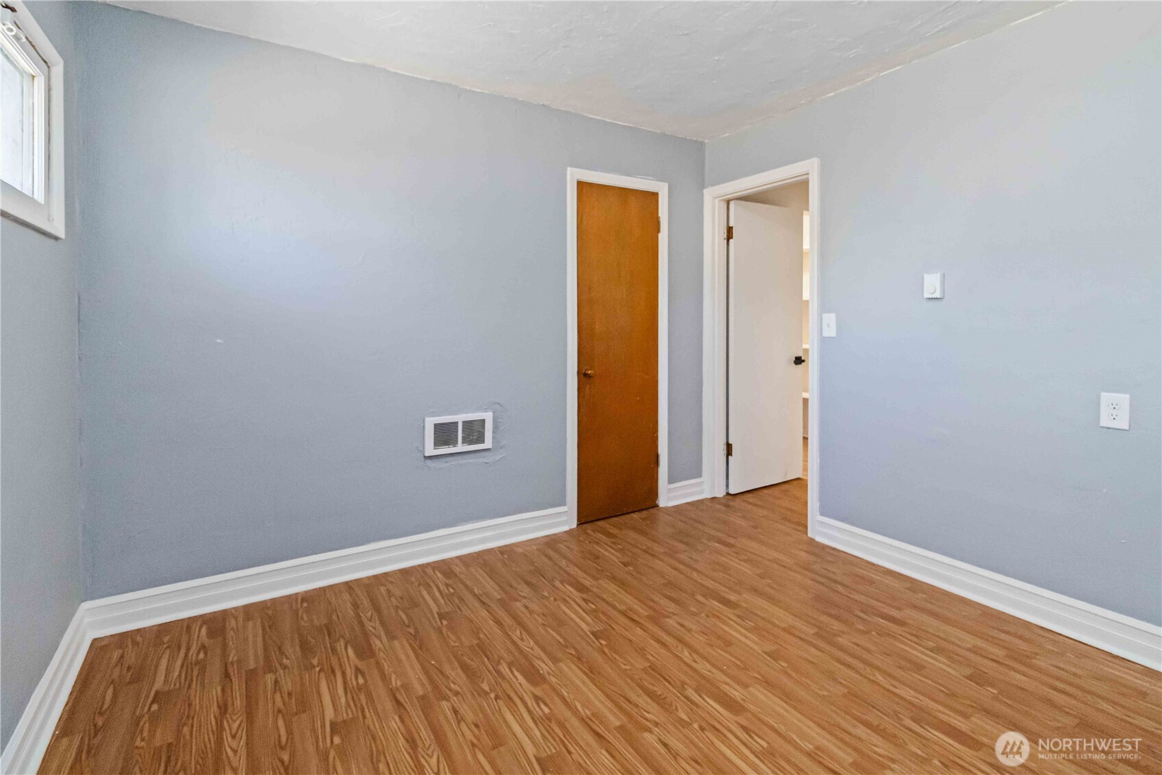 753 Southeast Sumner Street Camas, WA 98607 - Photo 21 of 37 a view of an empty room with wooden floor