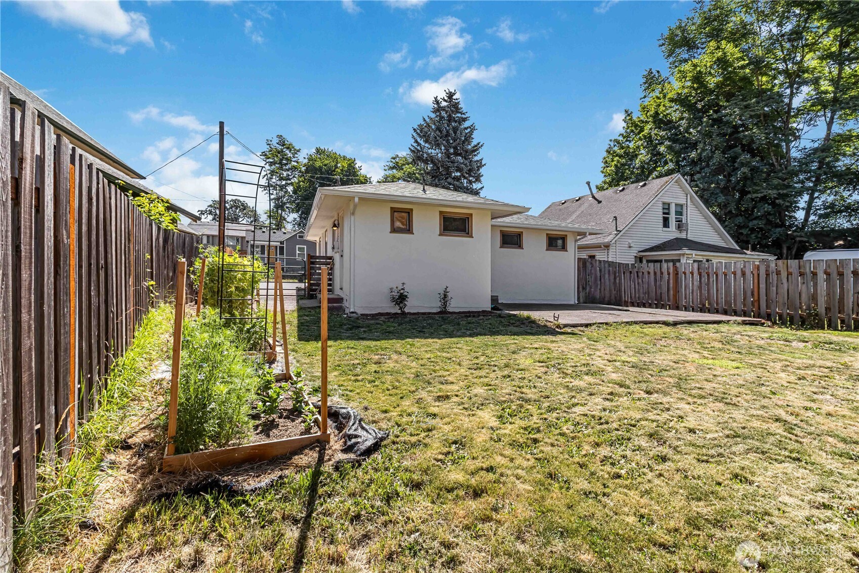 753 Southeast Sumner Street Camas, WA 98607 - Photo 26 of 37 a house with trees in front of it