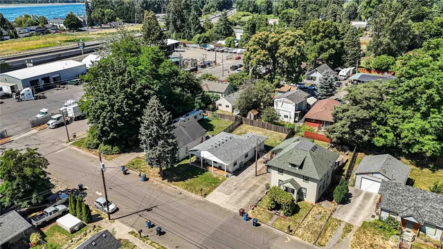 an aerial view of multiple houses with yard