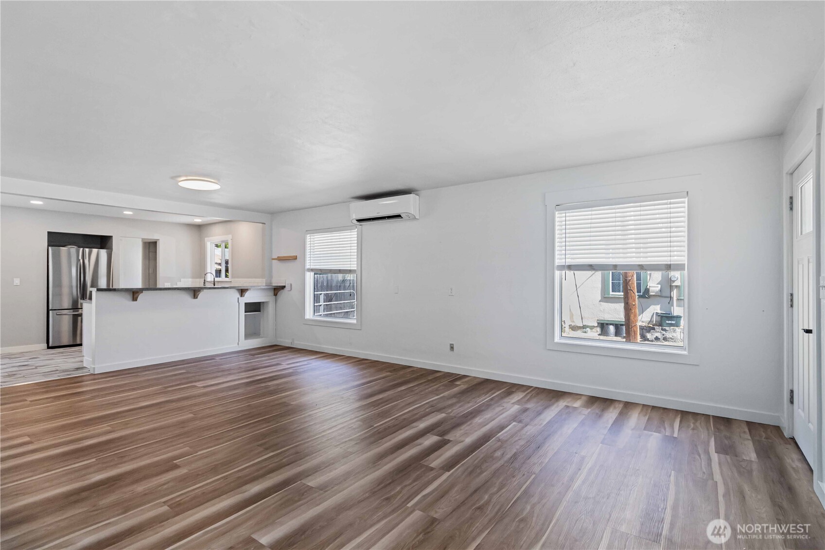 753 Southeast Sumner Street Camas, WA 98607 - Photo 9 of 37 a view of empty room with wooden floor and window