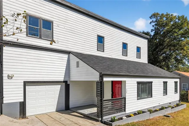 a front view of a house with a garage