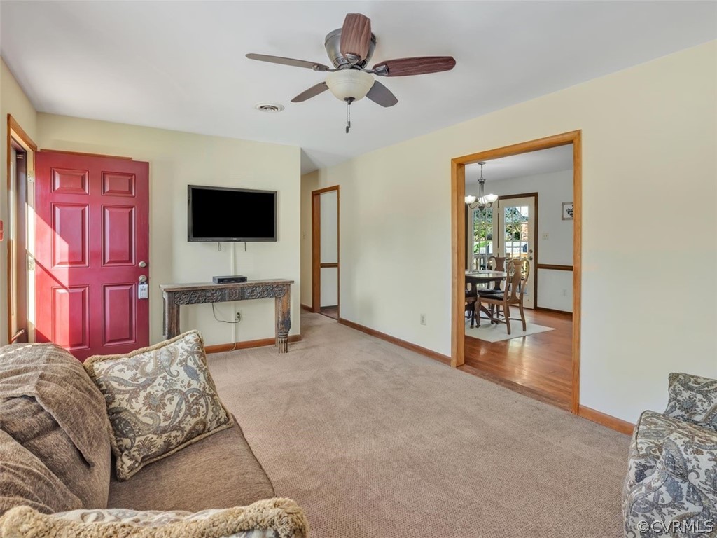 12020 Gardengate Road Midlothian, VA 23112 - Photo 3 of 25 a living room with furniture and a flat screen tv