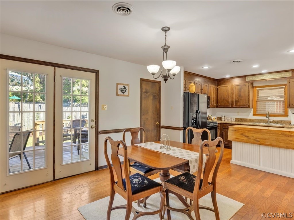 12020 Gardengate Road Midlothian, VA 23112 - Photo 6 of 25 a view of a dining room with furniture window and wooden floor