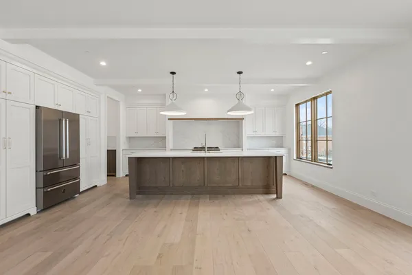 a kitchen with stainless steel appliances kitchen island wooden cabinets and granite counter tops