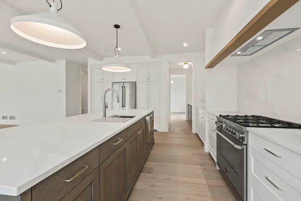 a kitchen with a sink and stove