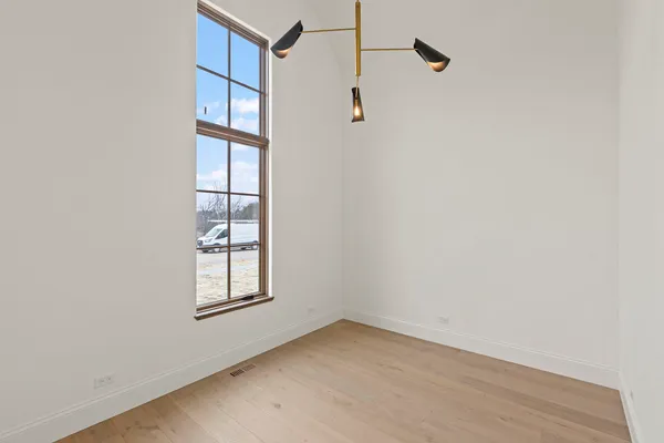 a view of an empty room with windows