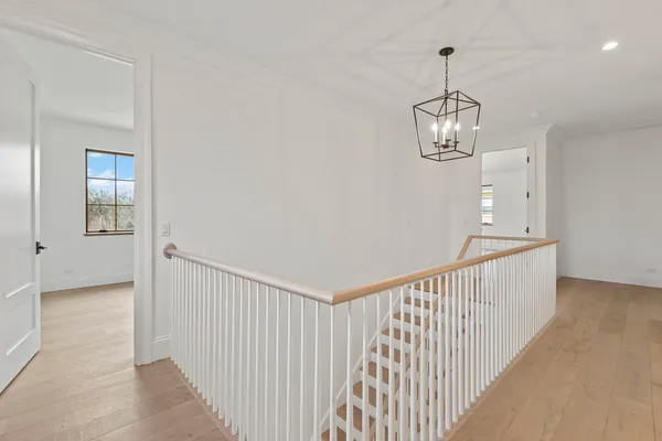 a view of a hallway with a chandelier