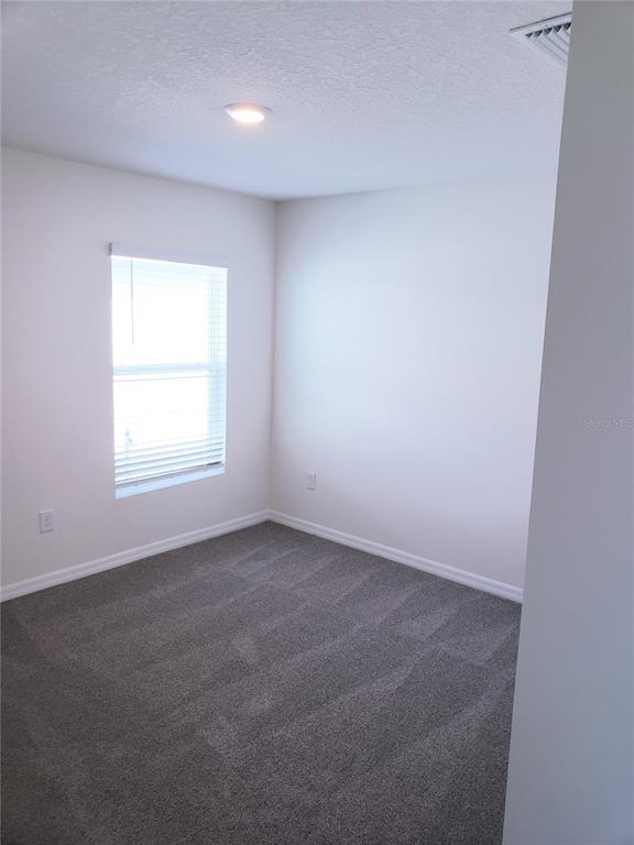 12211 Kingsley Trail Parrish, FL 34219 - Photo 24 of 28 an empty room with a window