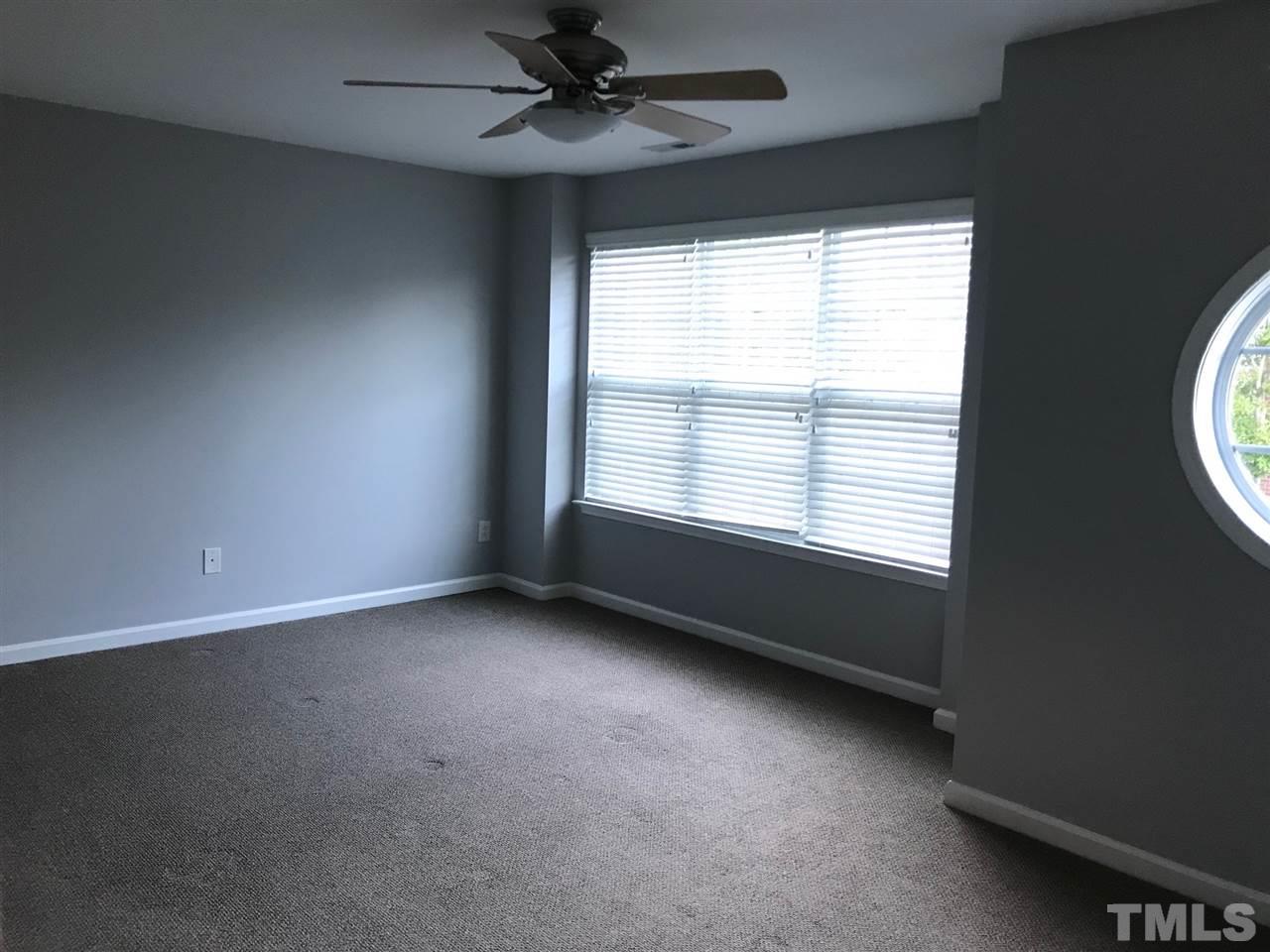 9904 Layla Avenue Raleigh, NC 27617 - Photo 13 of 19 an empty room with a window
