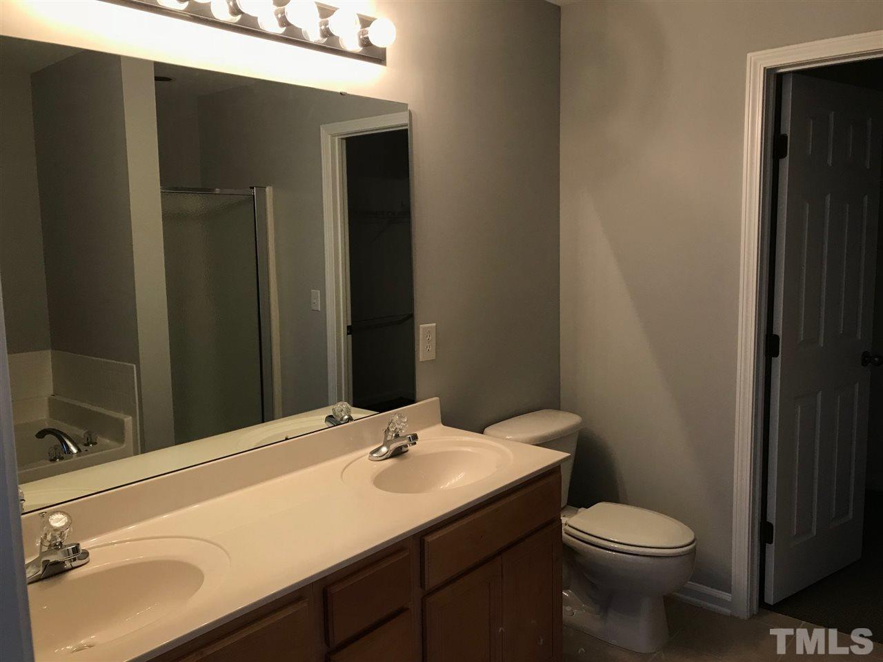 9904 Layla Avenue Raleigh, NC 27617 - Photo 14 of 19 a bathroom with a sink and a toilet