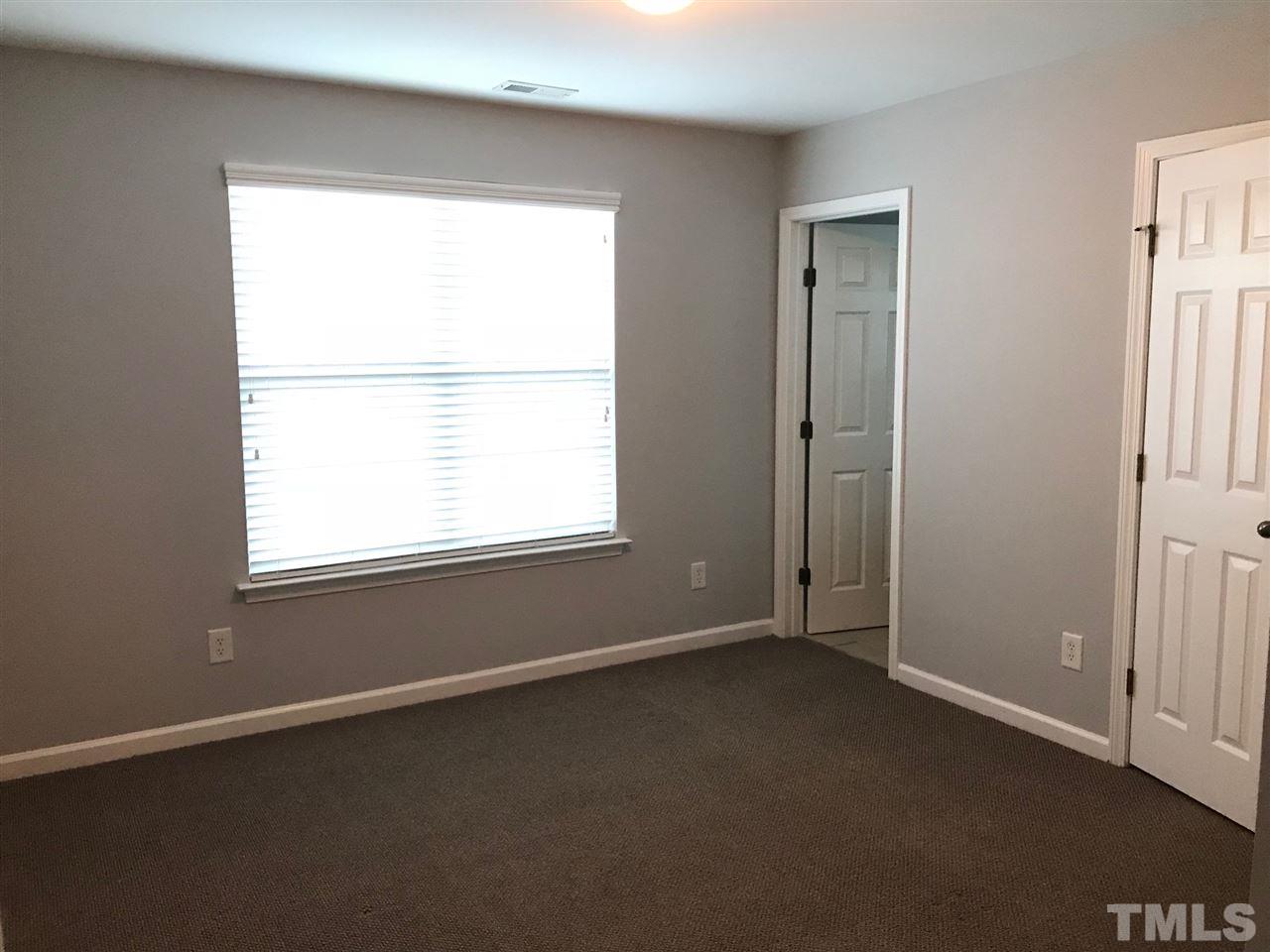 9904 Layla Avenue Raleigh, NC 27617 - Photo 15 of 19 an empty room with a window