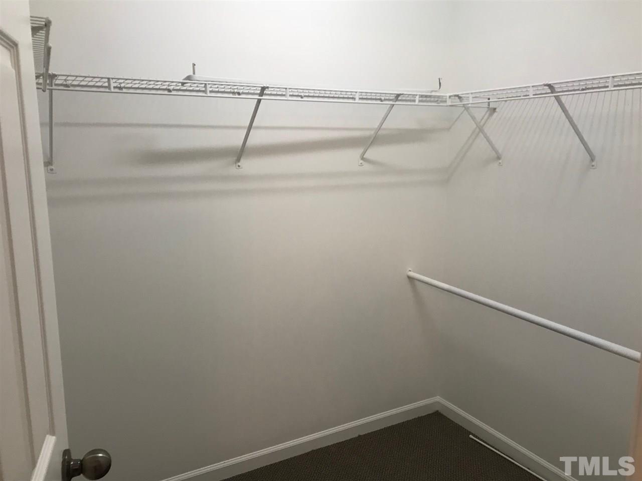 9904 Layla Avenue Raleigh, NC 27617 - Photo 19 of 19 a view of a room with racks on the wall