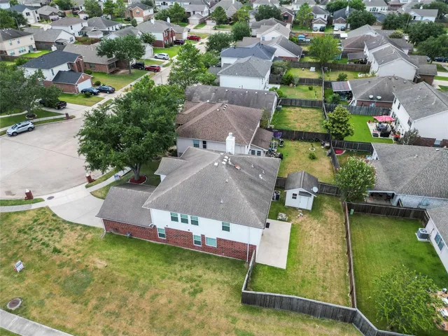 an aerial view of a house with swimming pool yard and outdoor seating