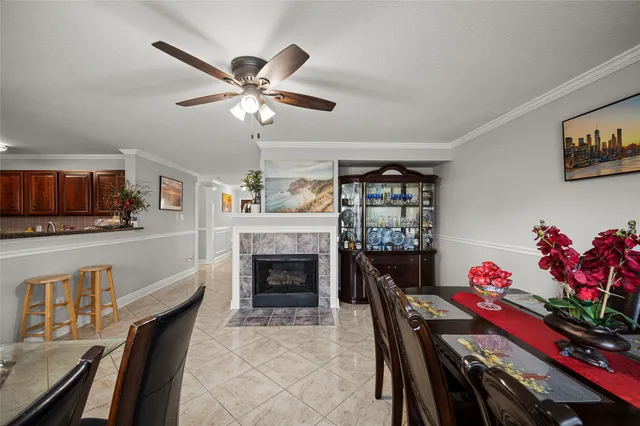 a living room with furniture fireplace and a window