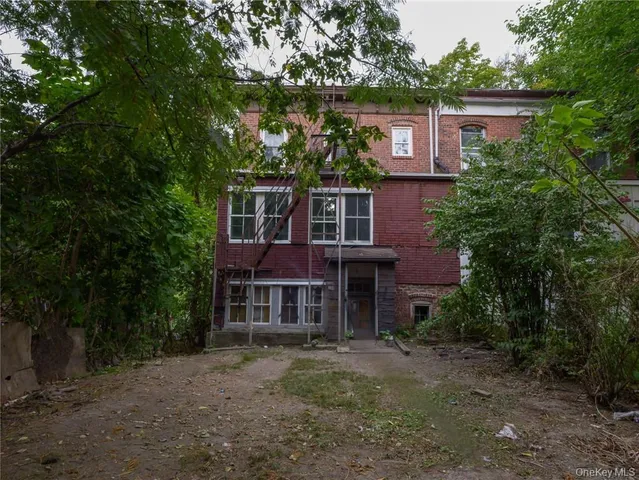 front view of a house with a tree
