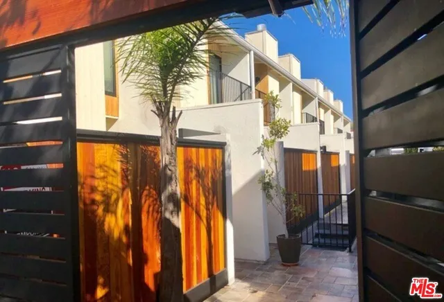a living room with furniture a fireplace and a table