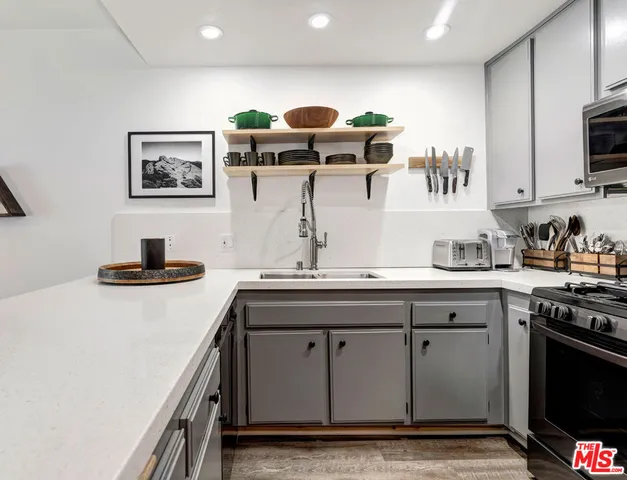 a view of a dining room with furniture and a chandelier