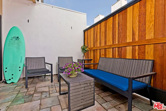 a view of a a dining room with furniture wooden floor and chandelier