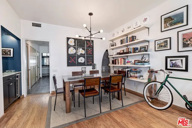 a kitchen with stainless steel appliances granite countertop a lot of counter space and living room