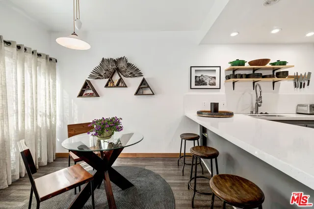 a kitchen with a sink stainless steel appliances and cabinets