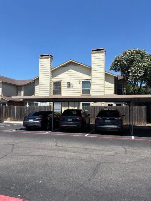 11311 Audelia Road, Unit 208 Dallas, TX 75243 - Photo 1 of 11 View of building exterior with covered parking