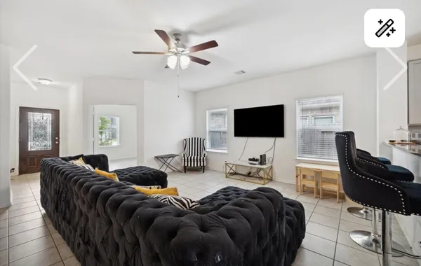a living room with furniture and a flat screen tv