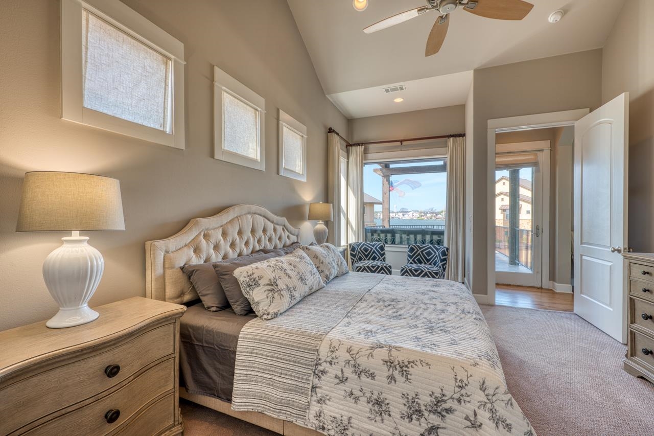 211 Chandler Way Kingsland, TX 78639 - Photo 13 of 40 a bedroom with a large bed and a window