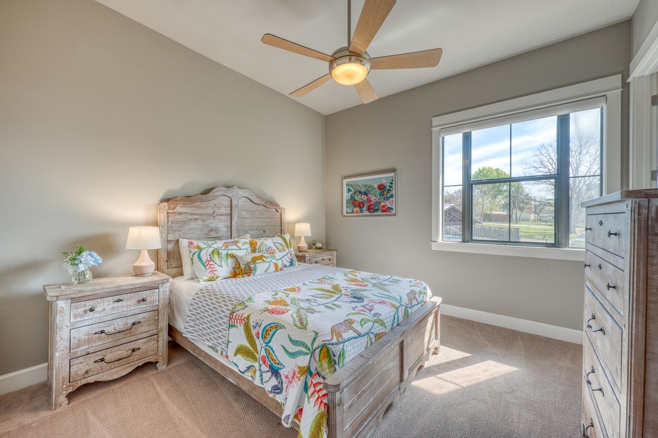 211 Chandler Way Kingsland, TX 78639 - Photo 18 of 40 a bedroom with a bed and a dresser