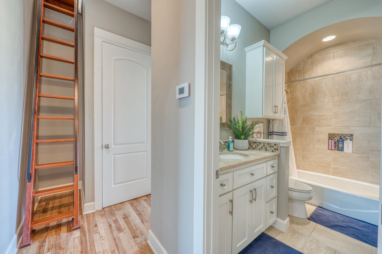 211 Chandler Way Kingsland, TX 78639 - Photo 20 of 40 a bathroom with a sink a mirror and a shower