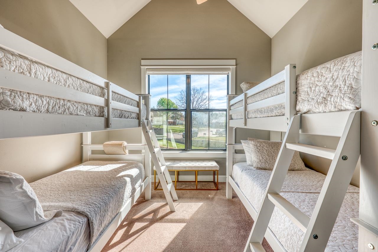 211 Chandler Way Kingsland, TX 78639 - Photo 21 of 40 a bed room with a bed and a large window