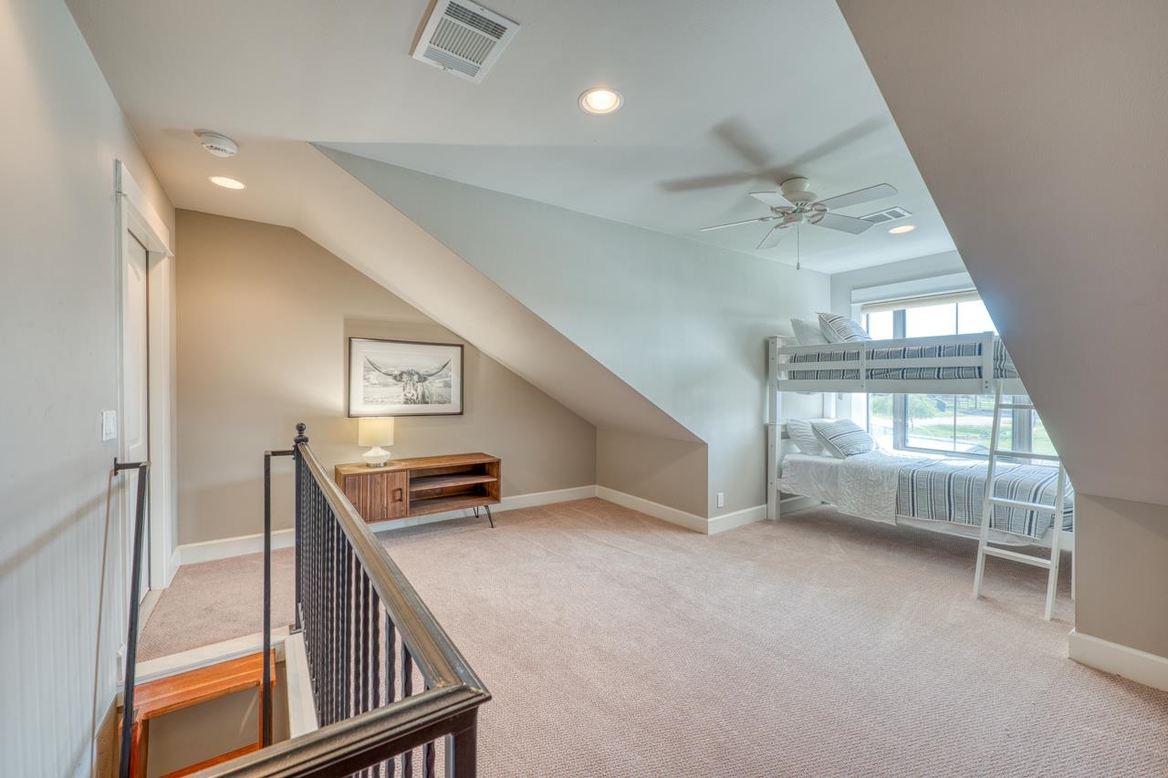 211 Chandler Way Kingsland, TX 78639 - Photo 23 of 40 en empty room with windows and ceiling fan