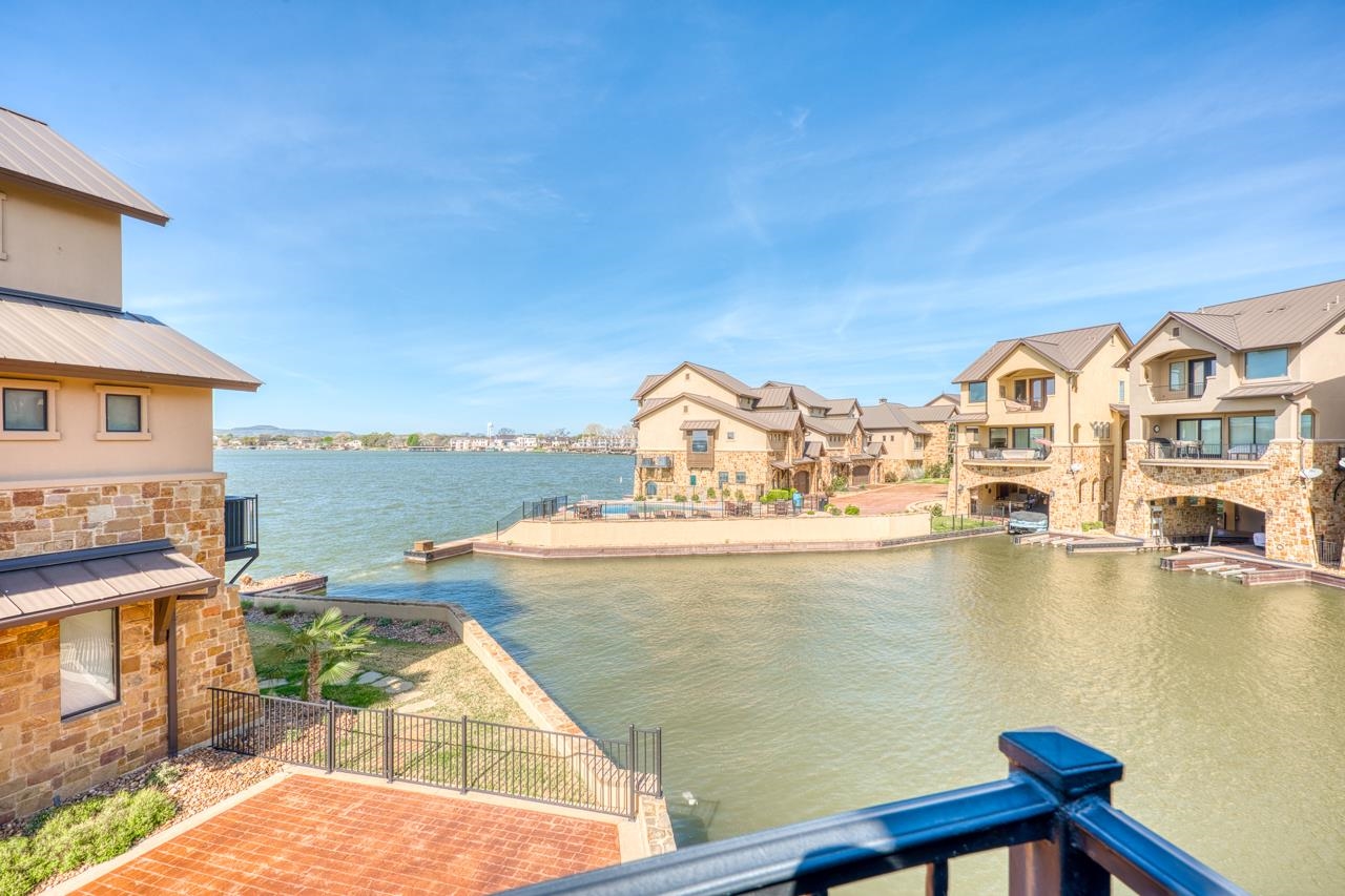 211 Chandler Way Kingsland, TX 78639 - Photo 26 of 40 a view of a lake with couches