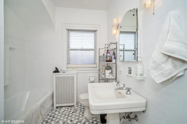 a bathroom with a sink a toilet and a bathtub