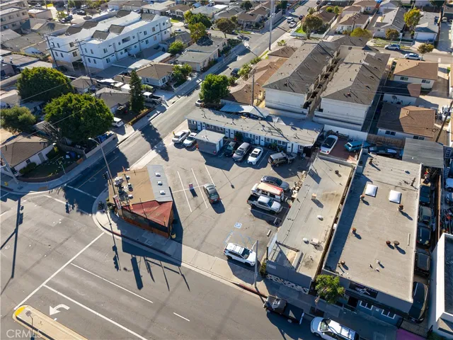 an aerial view of a couch with table and chairs