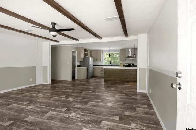 a view of a hallway with a stove