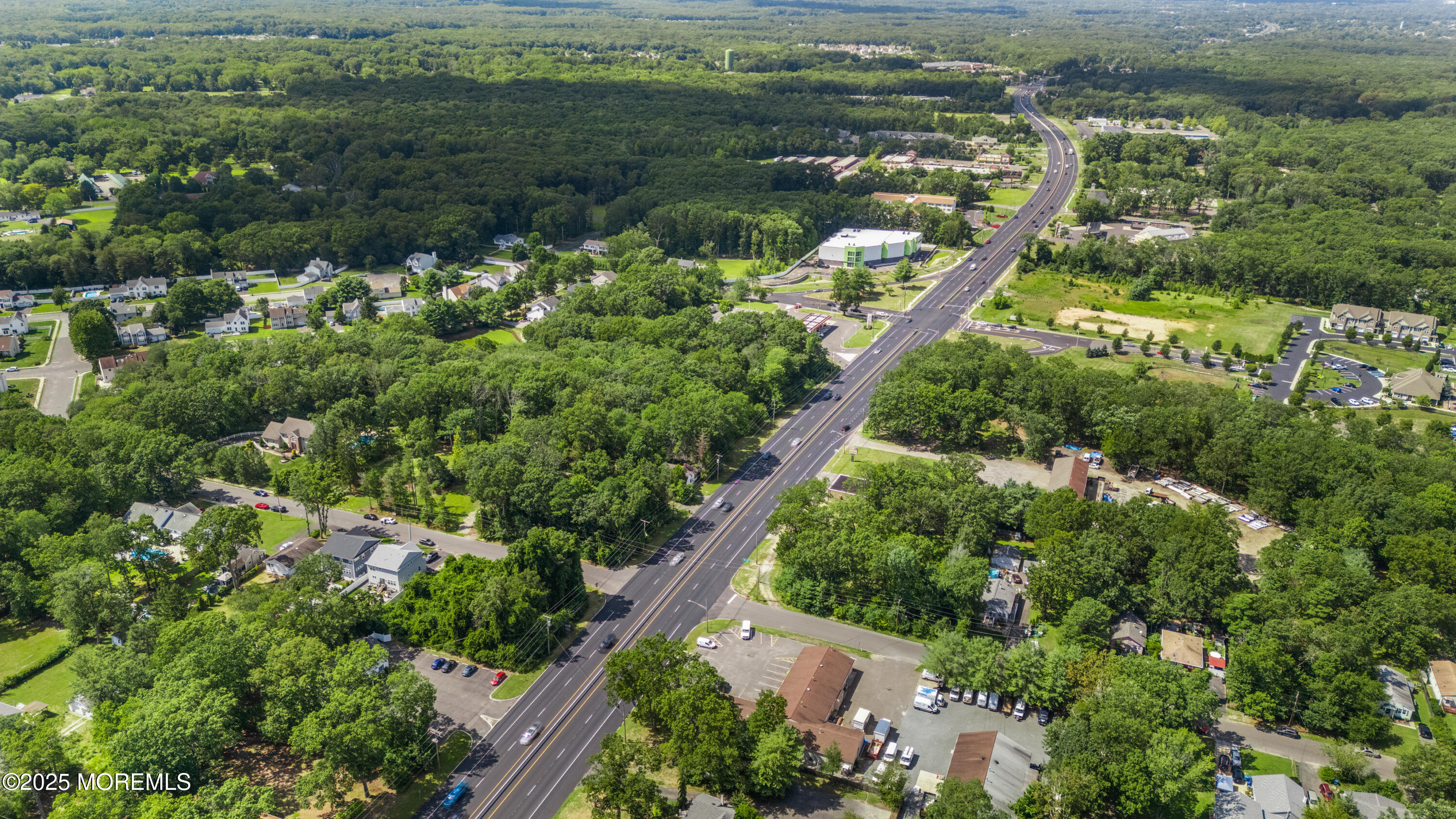 0 Route 9 Howell Nj 07731 Howell, NJ 07731 - Photo 12 of 13 an aerial view of residential houses with outdoor space and trees