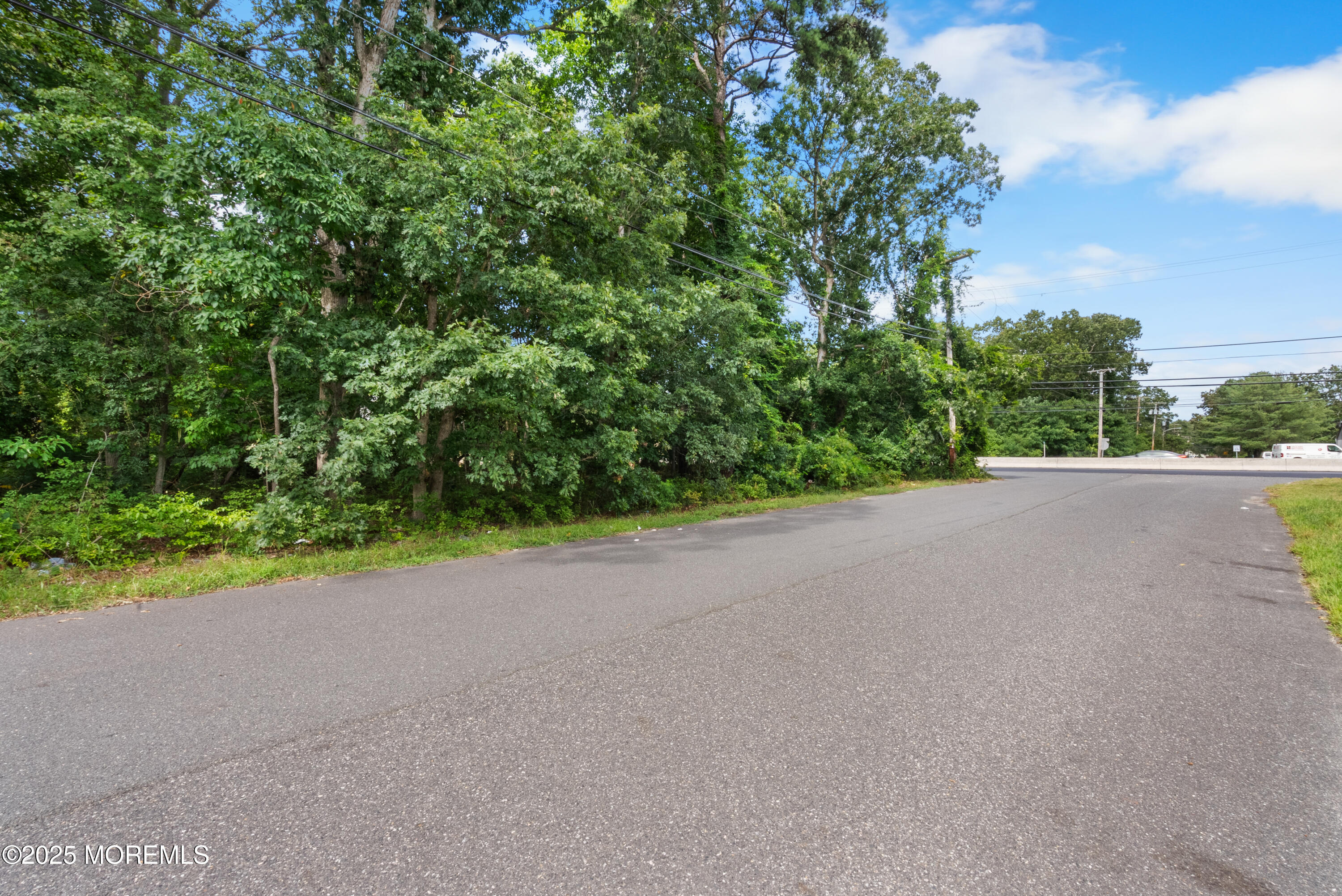 0 Route 9 Howell Nj 07731 Howell, NJ 07731 - Photo 7 of 13 a view of a road with a yard
