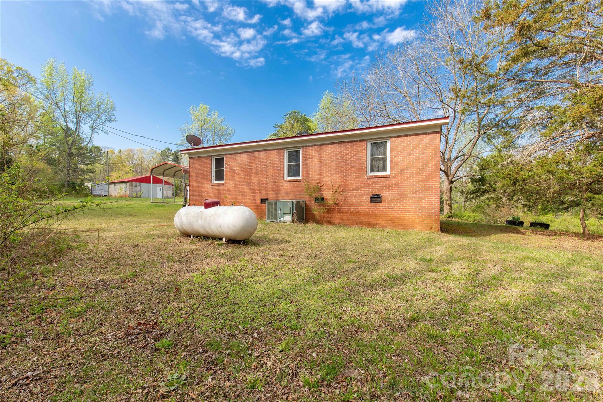 1724 State Rd S-29-39 Lancaster, SC 29720 - Photo 7 of 29 a backyard of a house with table and chairs
