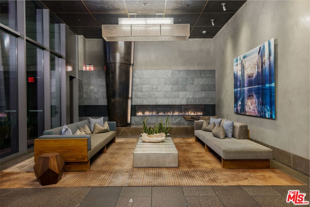 1755 Ocean Avenue, Unit 305 Santa Monica, CA 90401 - Photo 16 of 20 a living room with furniture and a fireplace