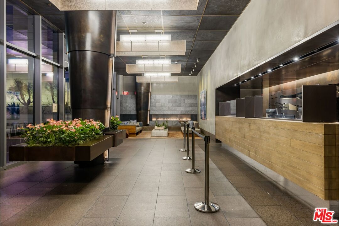 1755 Ocean Avenue, Unit 305 Santa Monica, CA 90401 - Photo 17 of 20 a lobby with furniture and potted plants