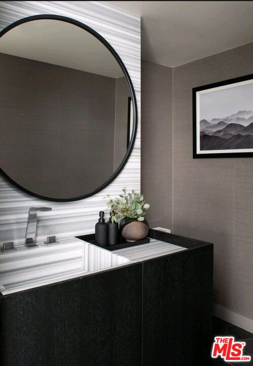 1755 Ocean Avenue, Unit 305 Santa Monica, CA 90401 - Photo 9 of 20 a close up of a sink and a mirror