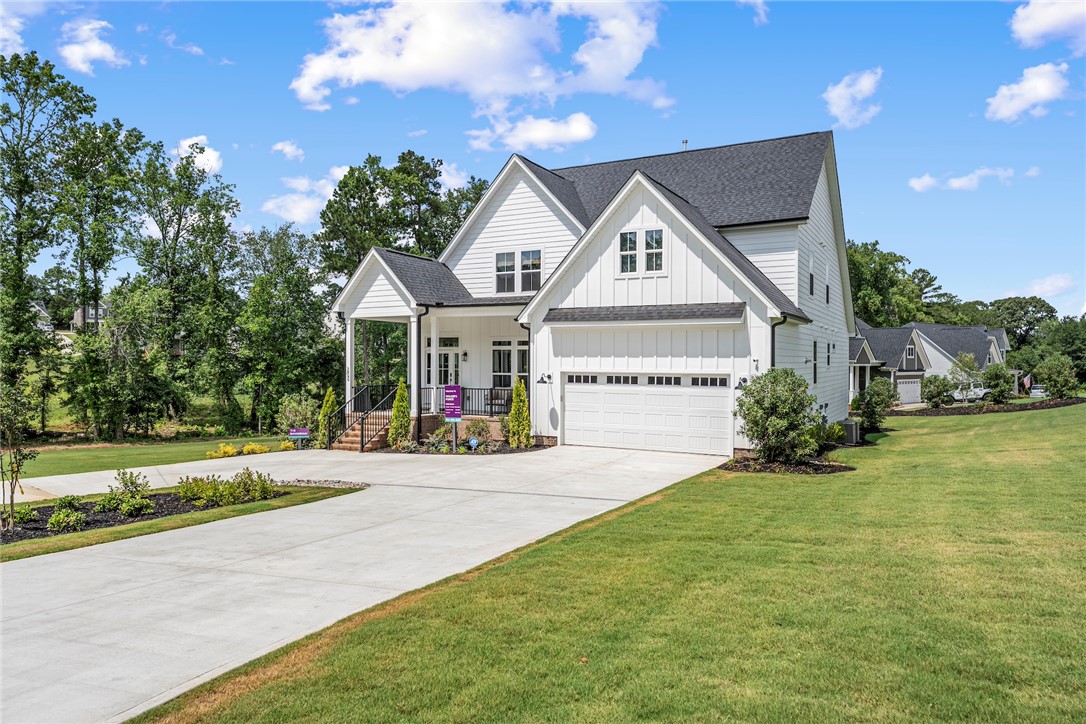 506 Tilman Court Anderson, SC 29621 - Photo 1 of 20 This newly constructed home features a charming exterior with a spacious lawn and inviting front porch.