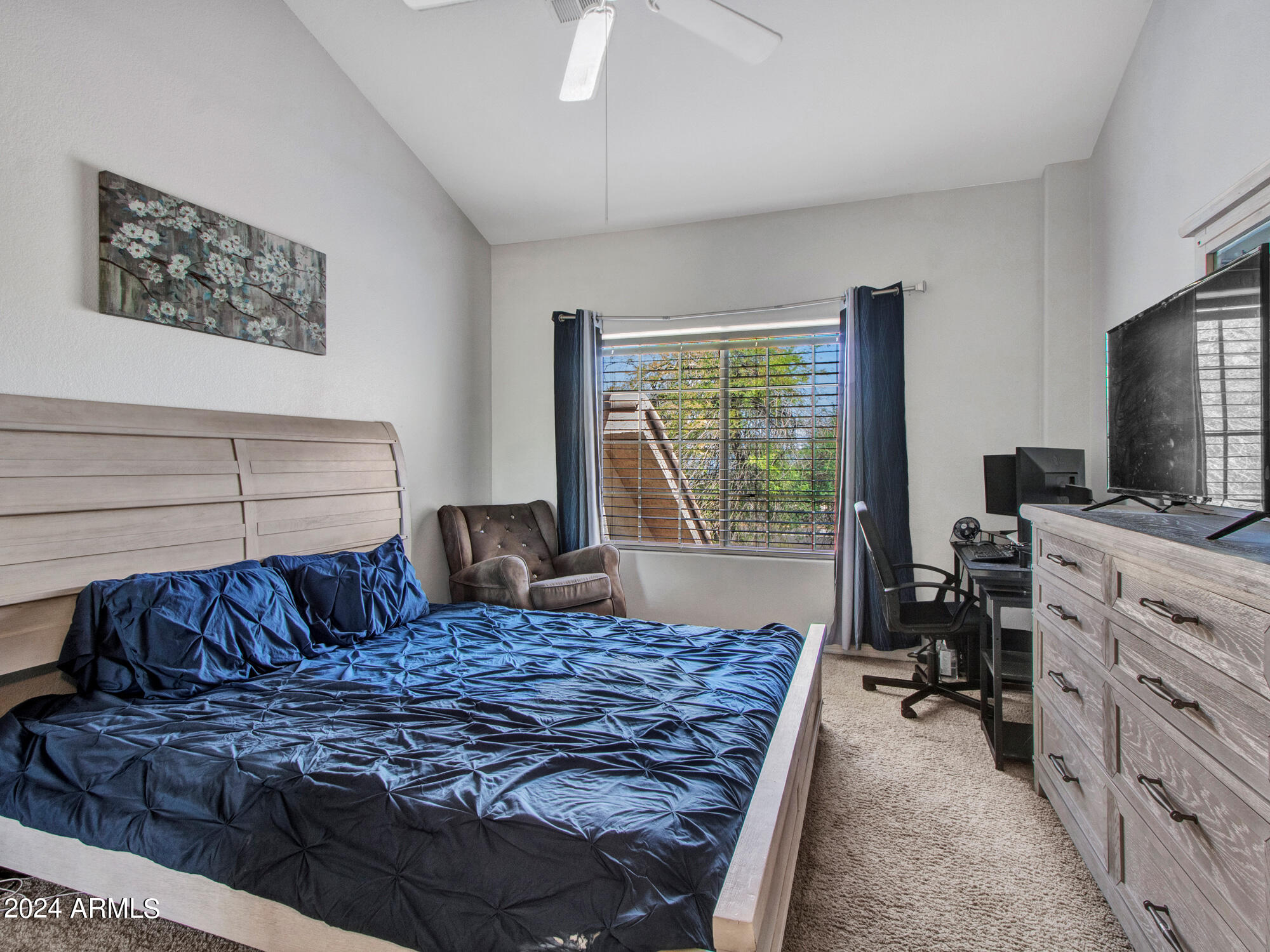 2801 North Litchfield Road, Unit 60 Goodyear, AZ 85395 - Photo 18 of 37 a bedroom with a bed and furniture
