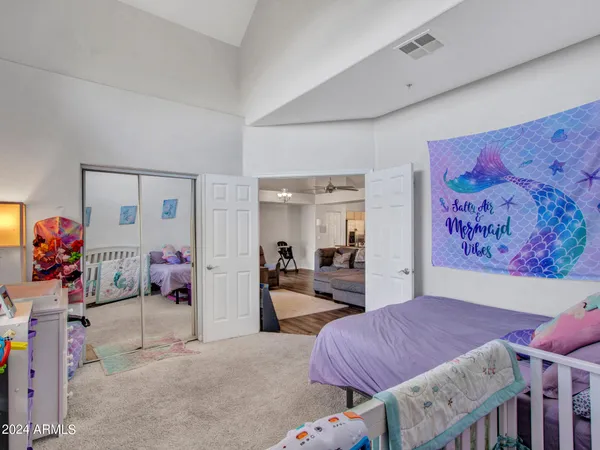 a bedroom with furniture and a window