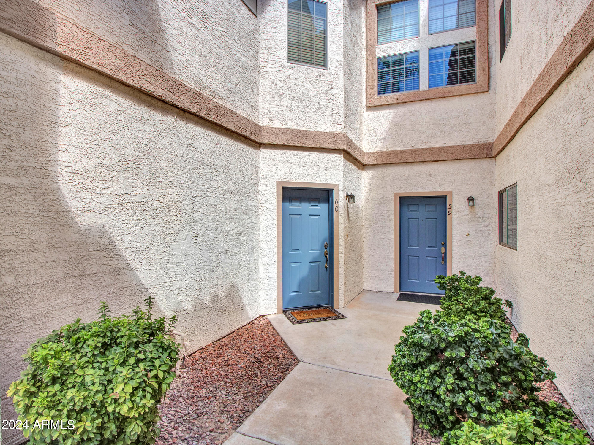 2801 North Litchfield Road, Unit 60 Goodyear, AZ 85395 - Photo 5 of 37 a front view of a house with a yard