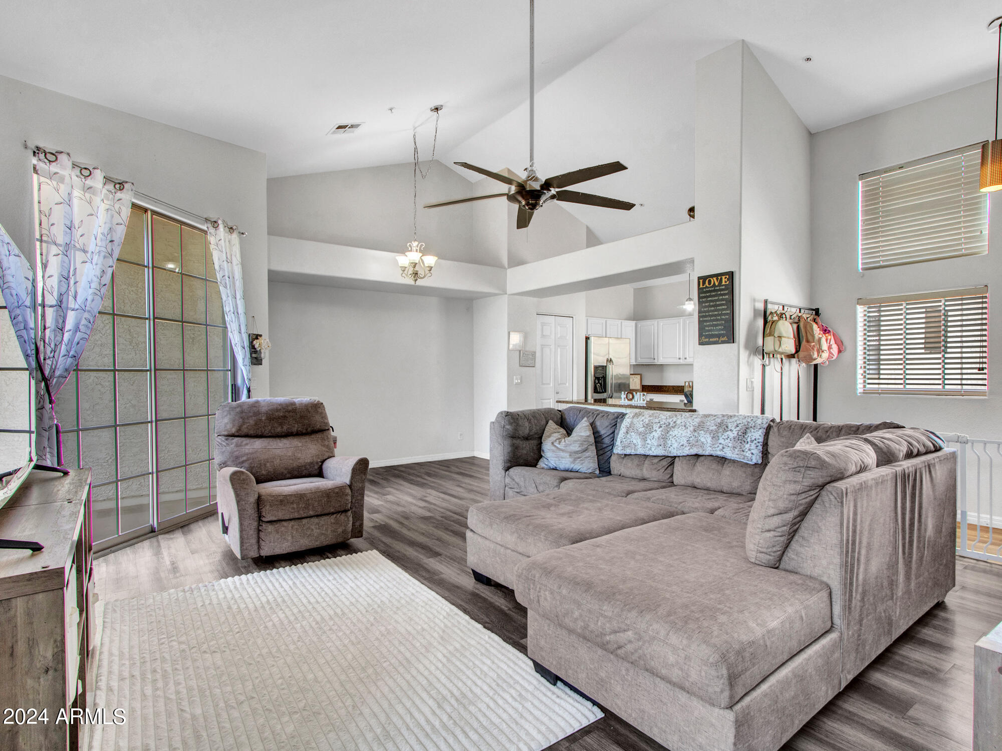 2801 North Litchfield Road, Unit 60 Goodyear, AZ 85395 - Photo 9 of 37 a living room with furniture and a ceiling fan