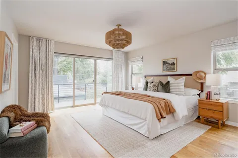 a bedroom with bed and a window