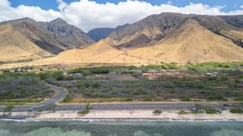 a view of a town with mountains in the background