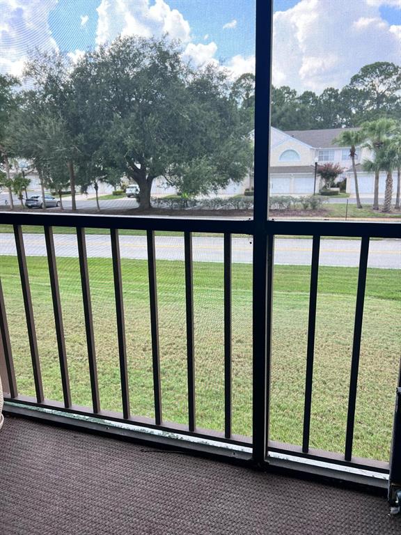 3244 Candle Ridge Drive, Unit 202 Orlando, FL 32822 - Photo 12 of 61 a view of a street from a balcony