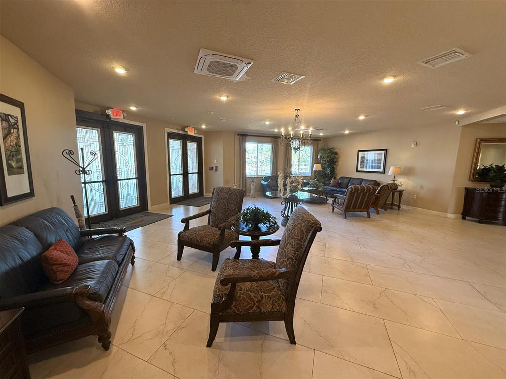 3244 Candle Ridge Drive, Unit 202 Orlando, FL 32822 - Photo 21 of 61 a living room with furniture and a large window
